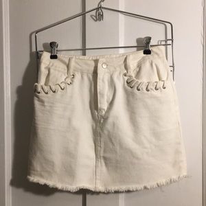 White denim skirt with shoelace detail on pockets